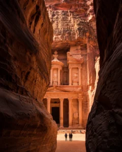 Travellers exploring Petra on a Jordan tour package from India with Delhi's best travel agency, Roameaze.