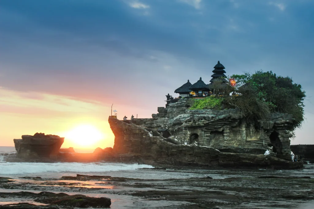 Tanah Lot Temple in Bali at sunset for customised Bali travel packages by Roameaze